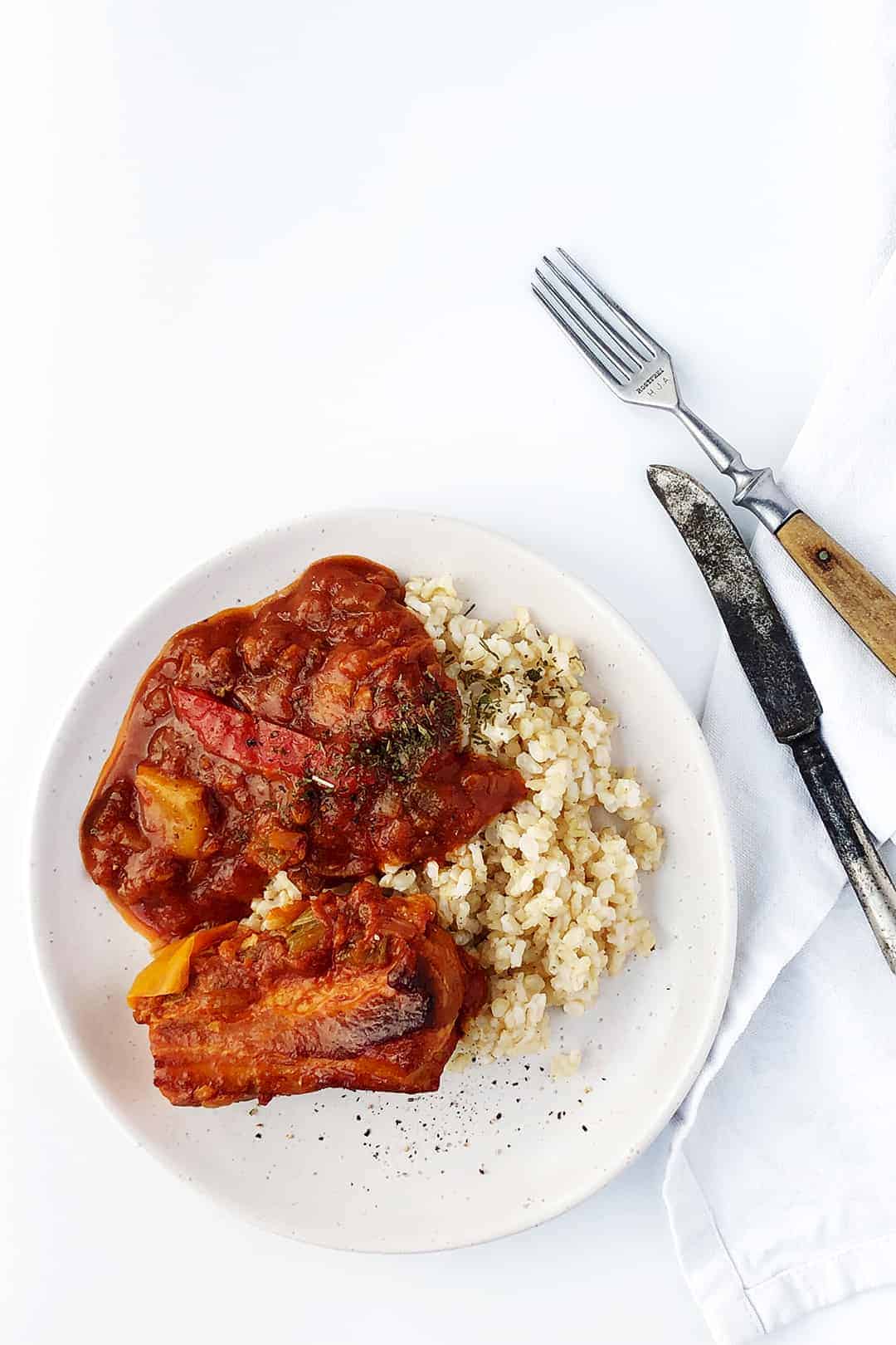 Slow cooked pork belly braised in tomato sauce