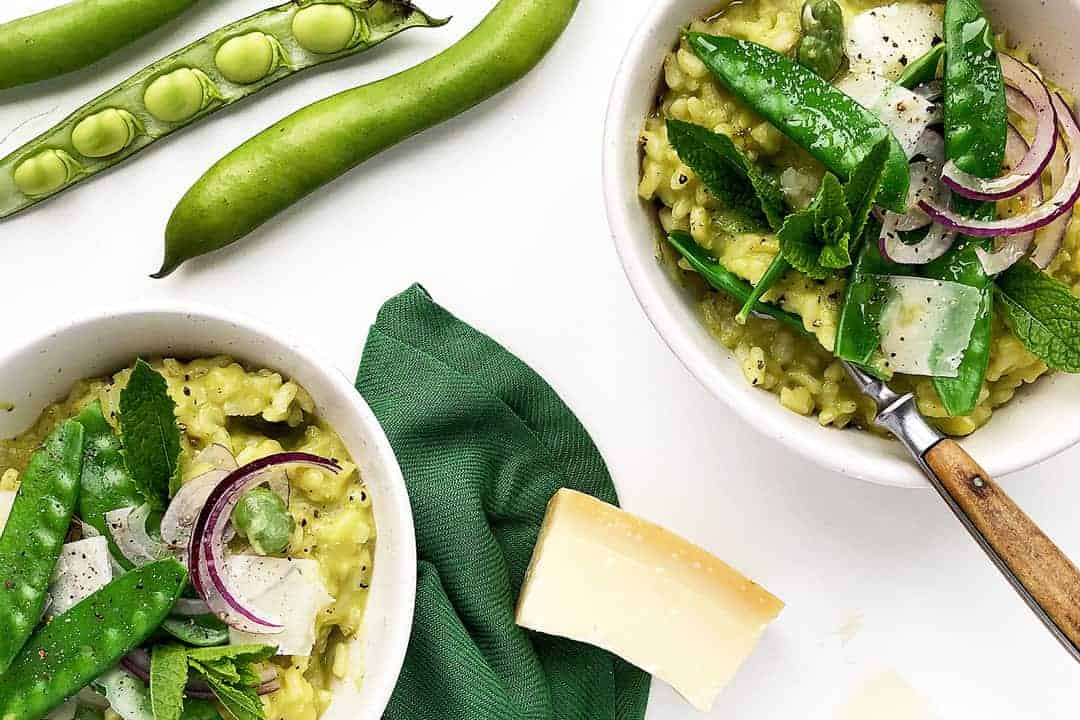 Green vegetarian risotto with mangetout and broad beans