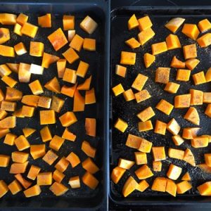 roasting cubbed butternut squash on two oven trays