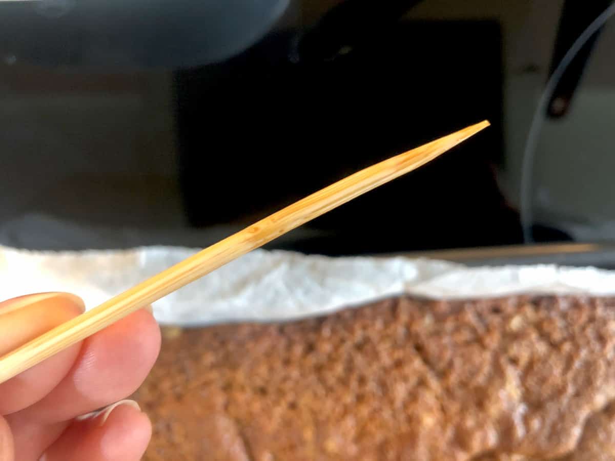 testing banana bread sponge with a skewer