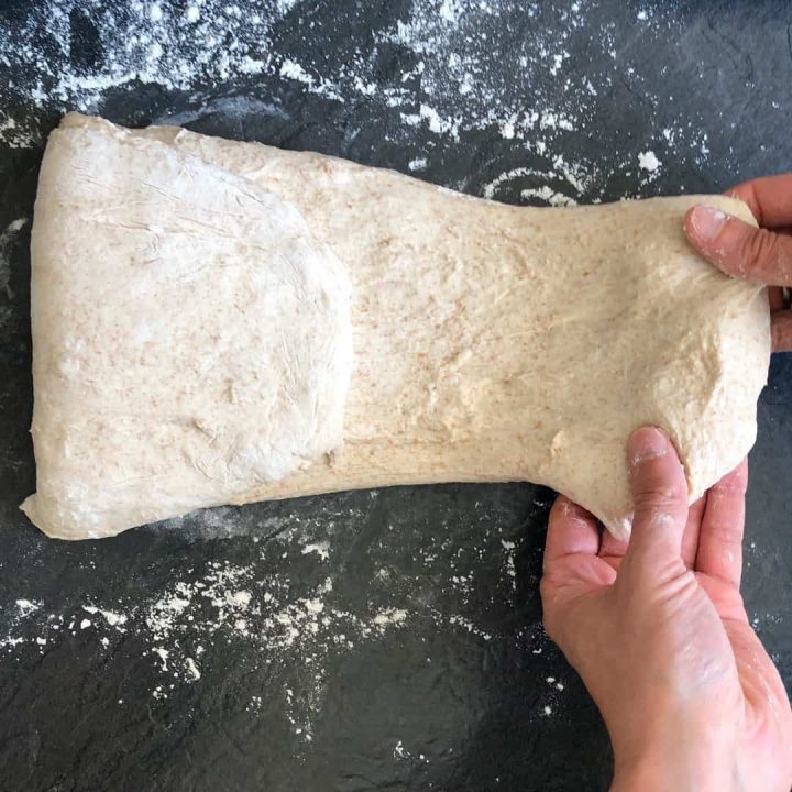 folding sourdough for a loaf tin