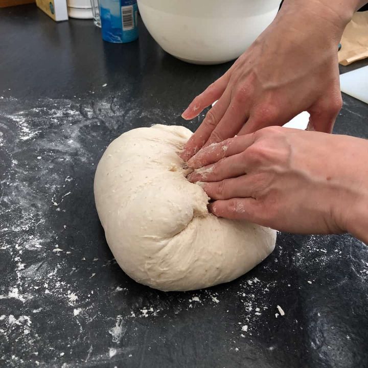 shaping round sourdough bread
