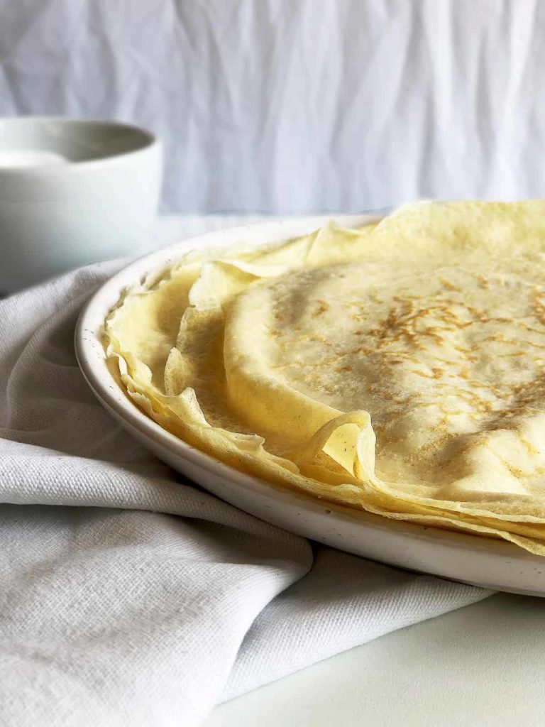 Crepe style English pancakes on a plate