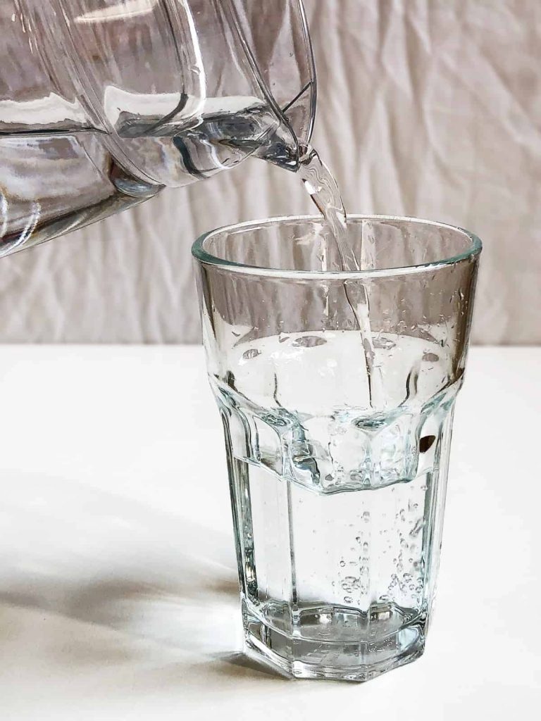 pouring water into a glass