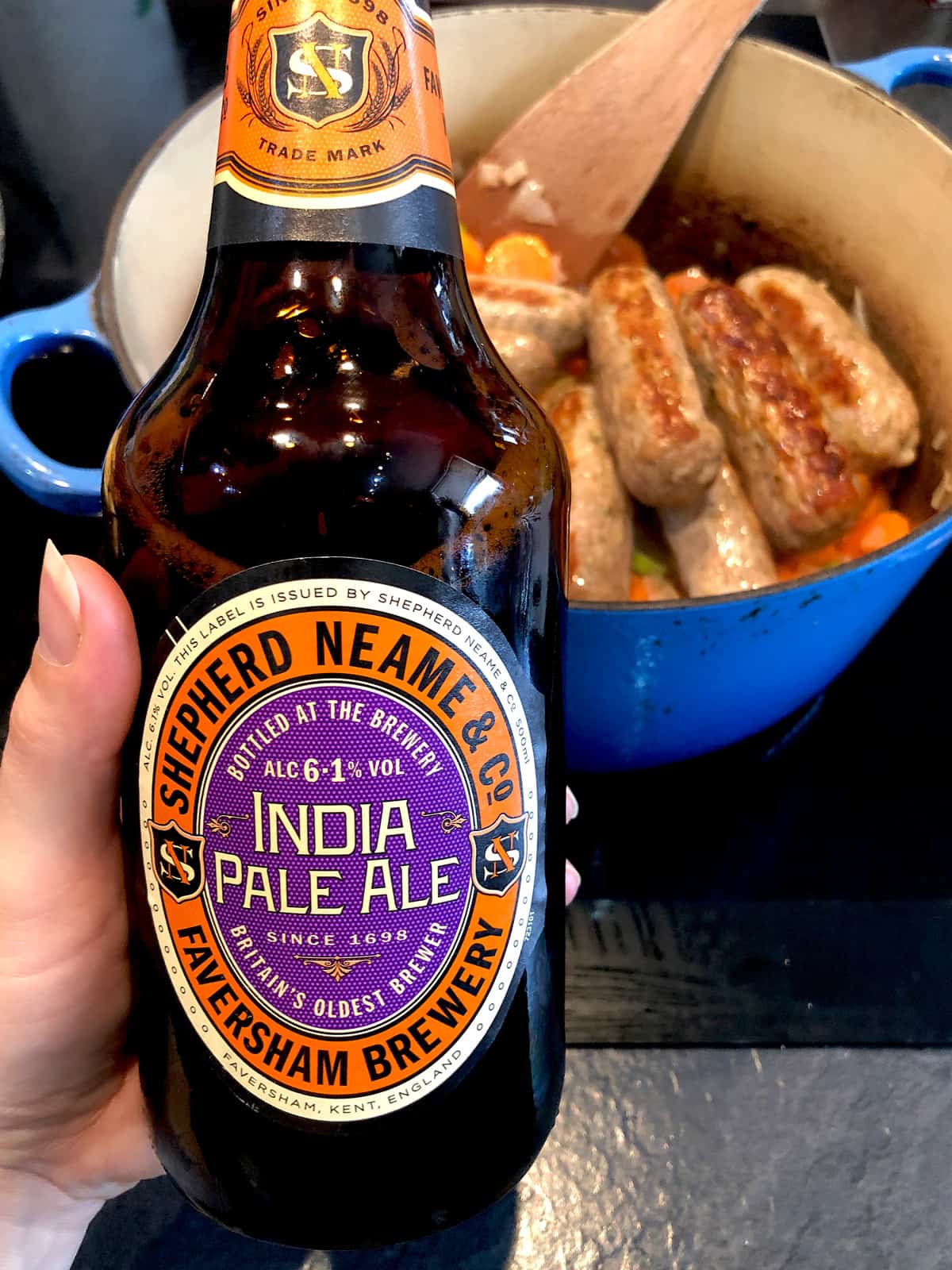 a hand holding India Pale Ale 