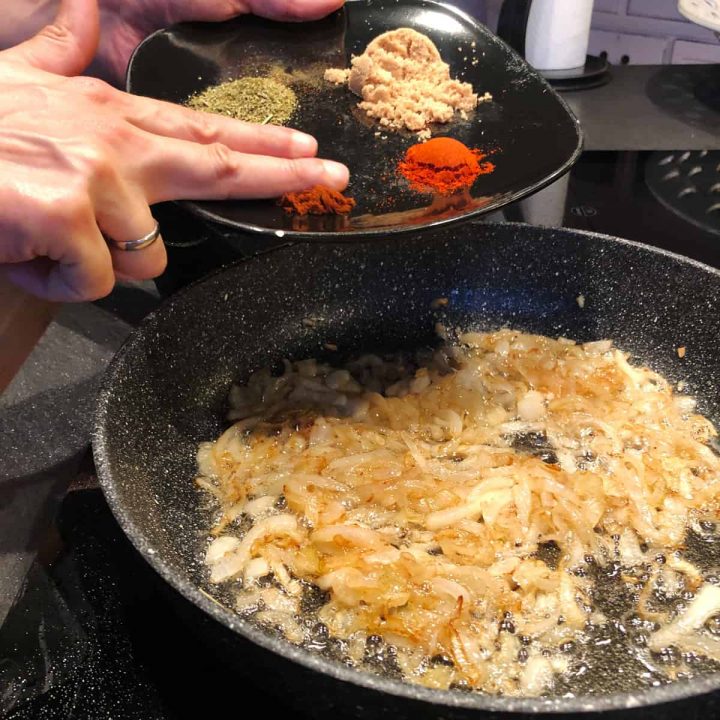 adding spices and herbs into the meal