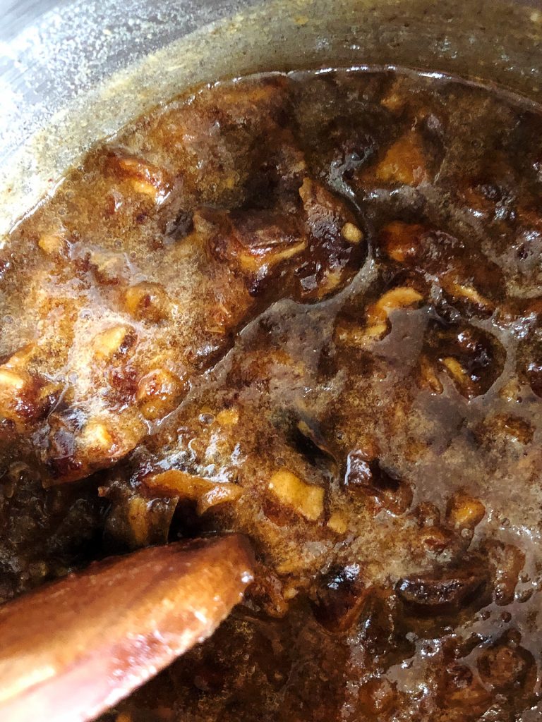 Soaking chopped dates in a pot