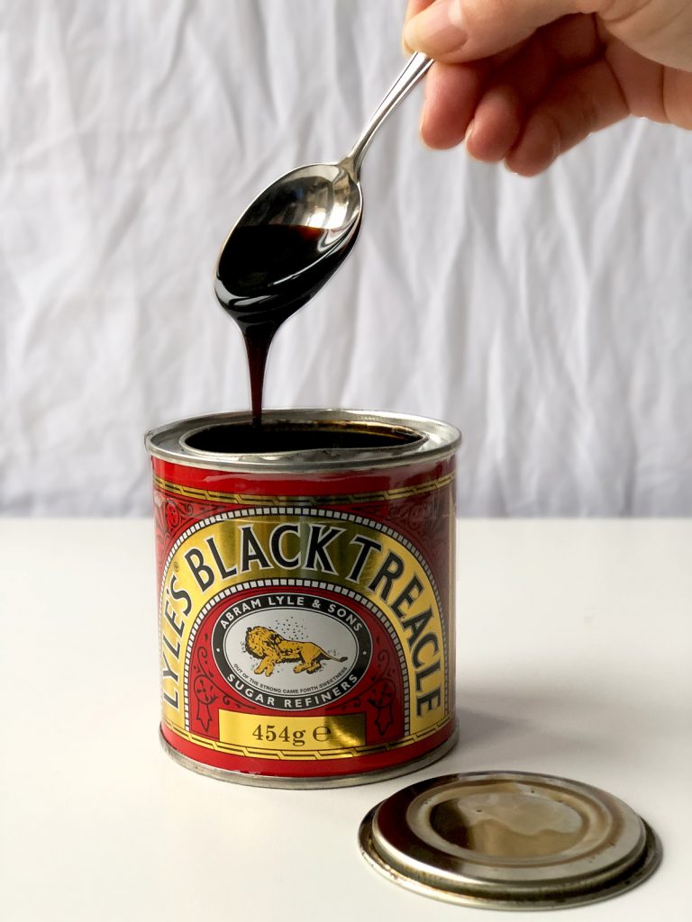 black treacle dripping from the spoon