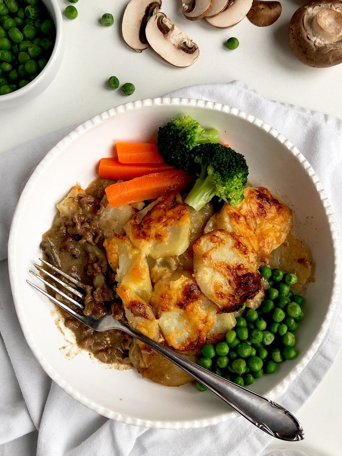 one serving of cottage pie with braised vegetable
