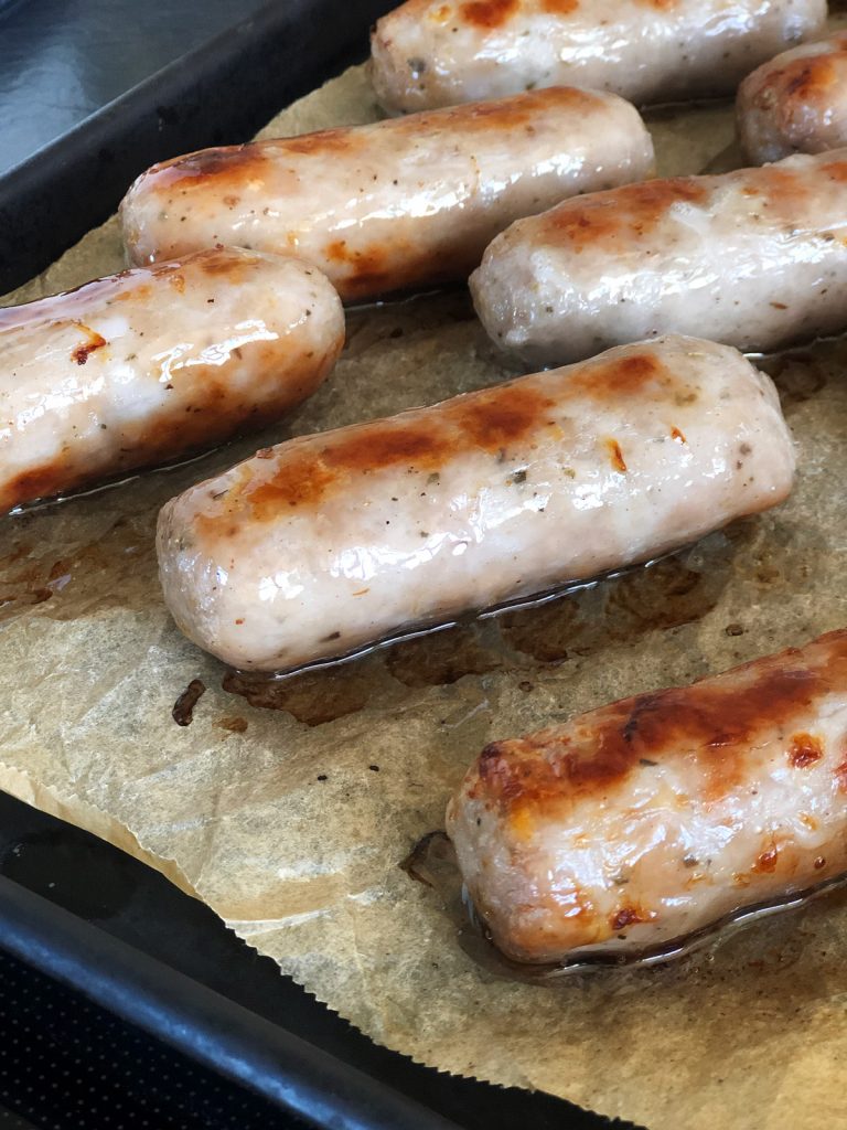 browned sausages on a tray
