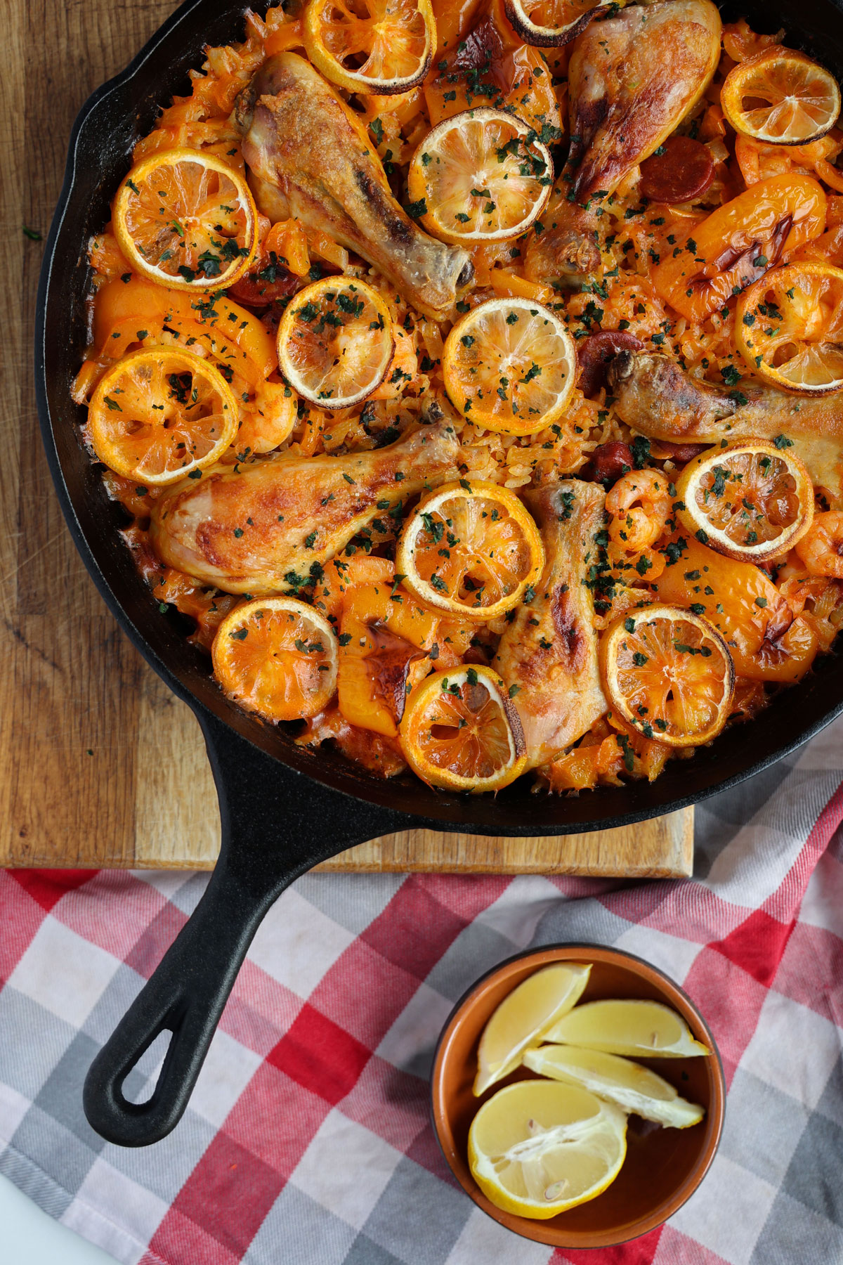A bird-eye view - Paella with chicken and sliced lemon.