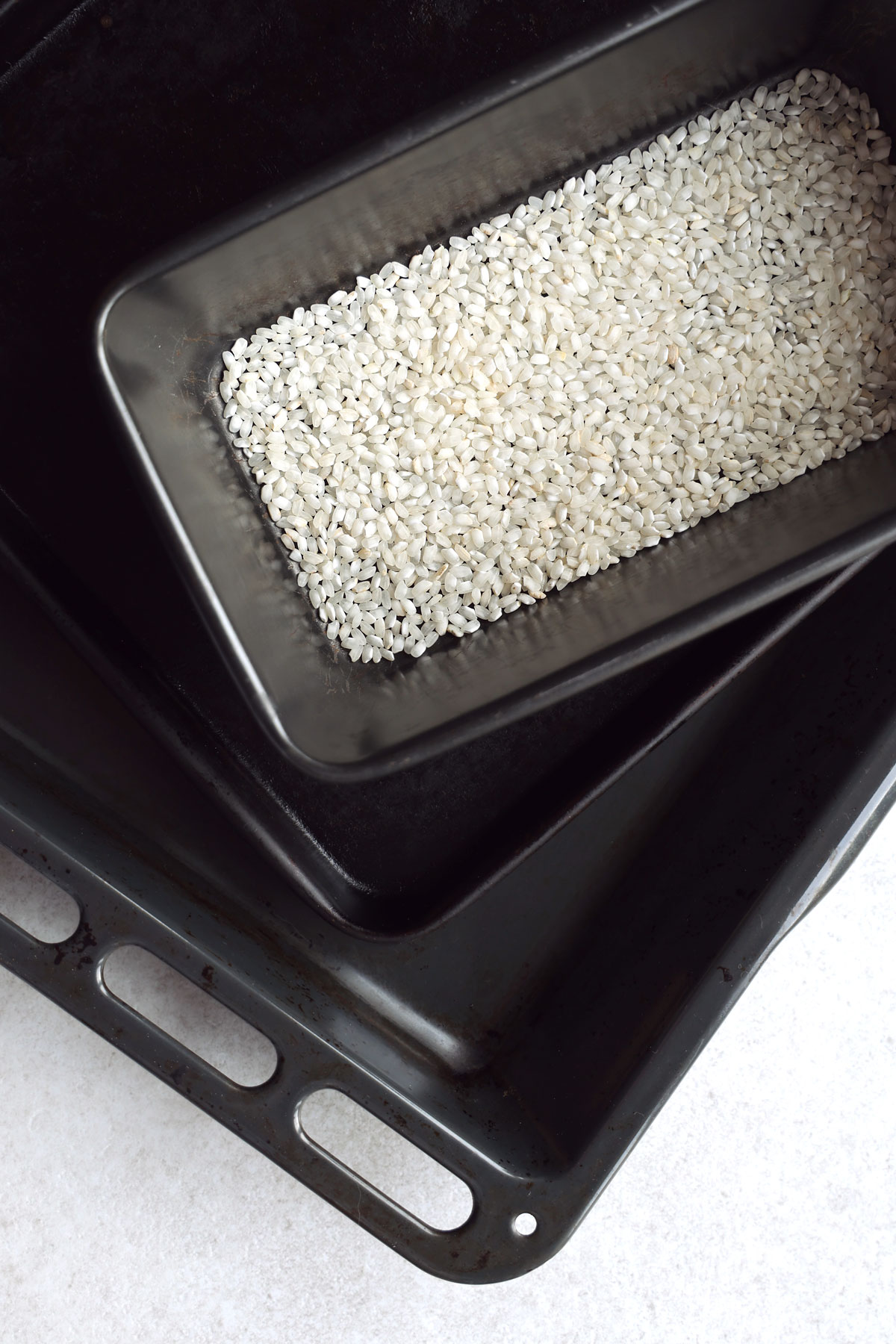 A selection of three diffrent sized metal oven trays.