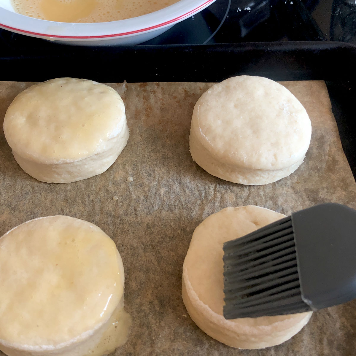 Giving scones egg-wash. 