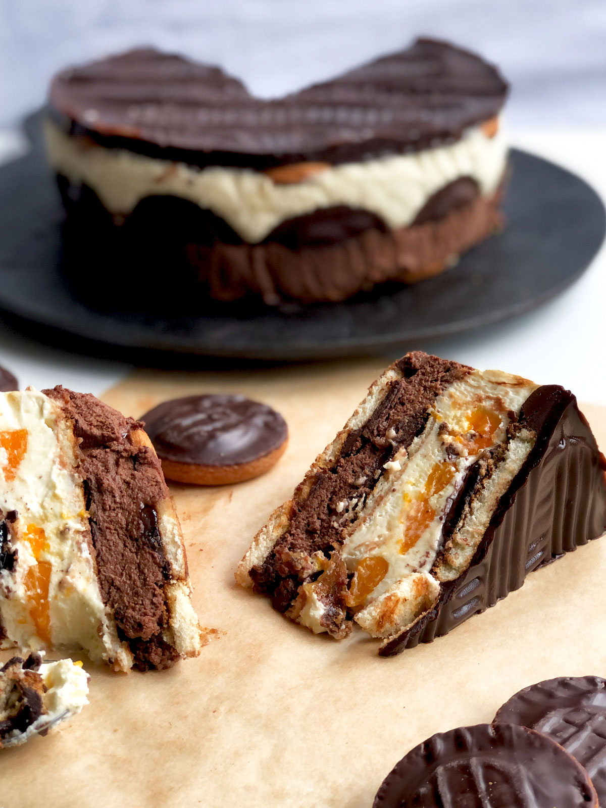 Two slices of no-bake cake and the accual cake at the background.