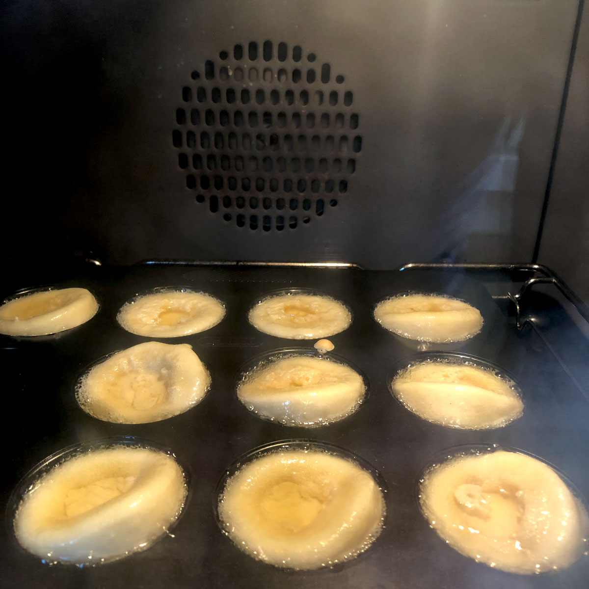 Rising Yorkshire puddings inside the oven at 180C..