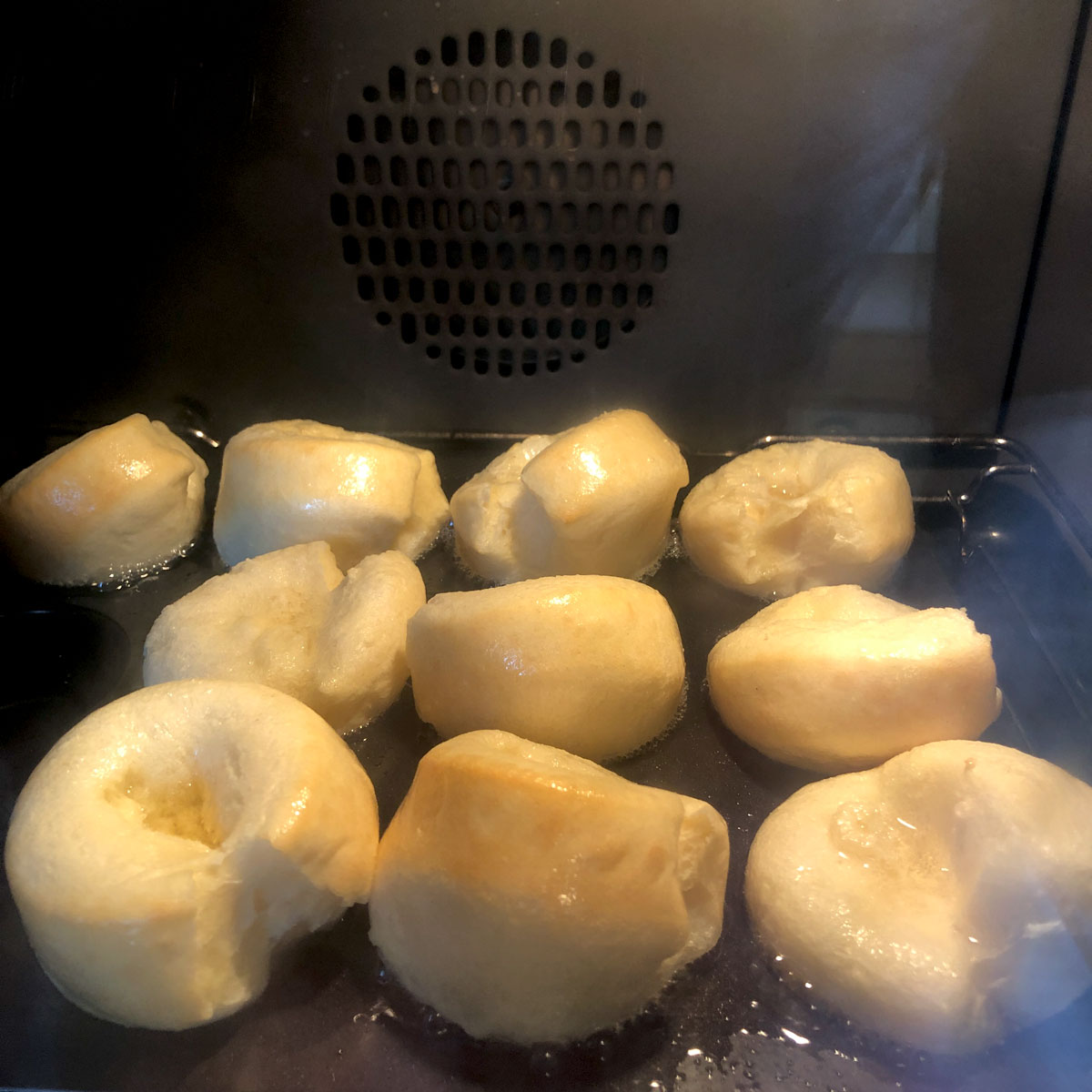 Rising Yorkshire puddings inside the oven at 180C.