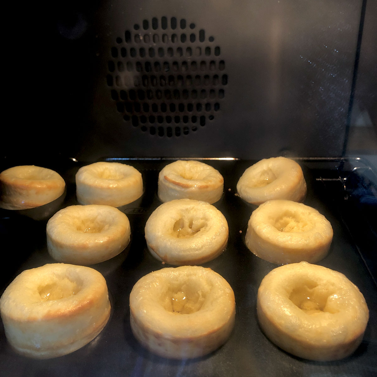 Rising Yorkshire puddings inside the oven at 250C.