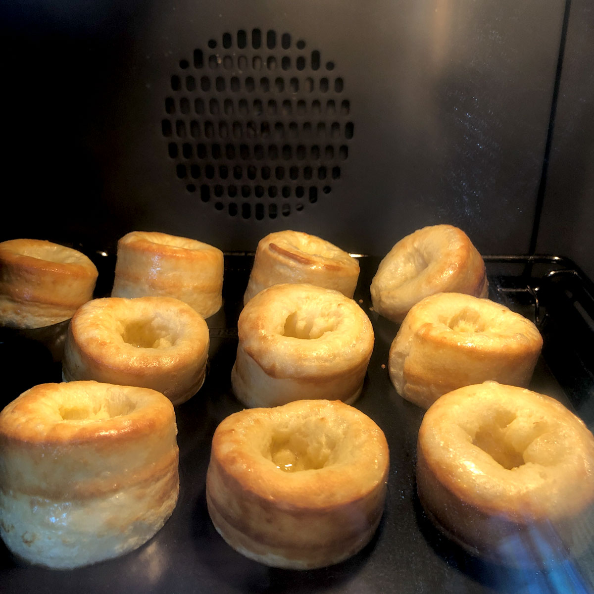 Rising Yorkshire puddings inside the oven at 250C.