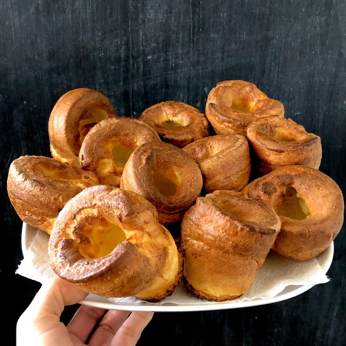 Yorkshire puddings on a plate.
