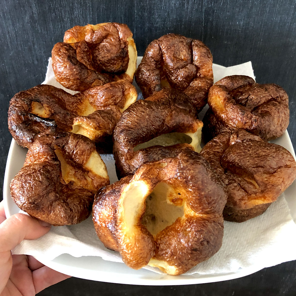 Yorkshire puddings on a plate.
