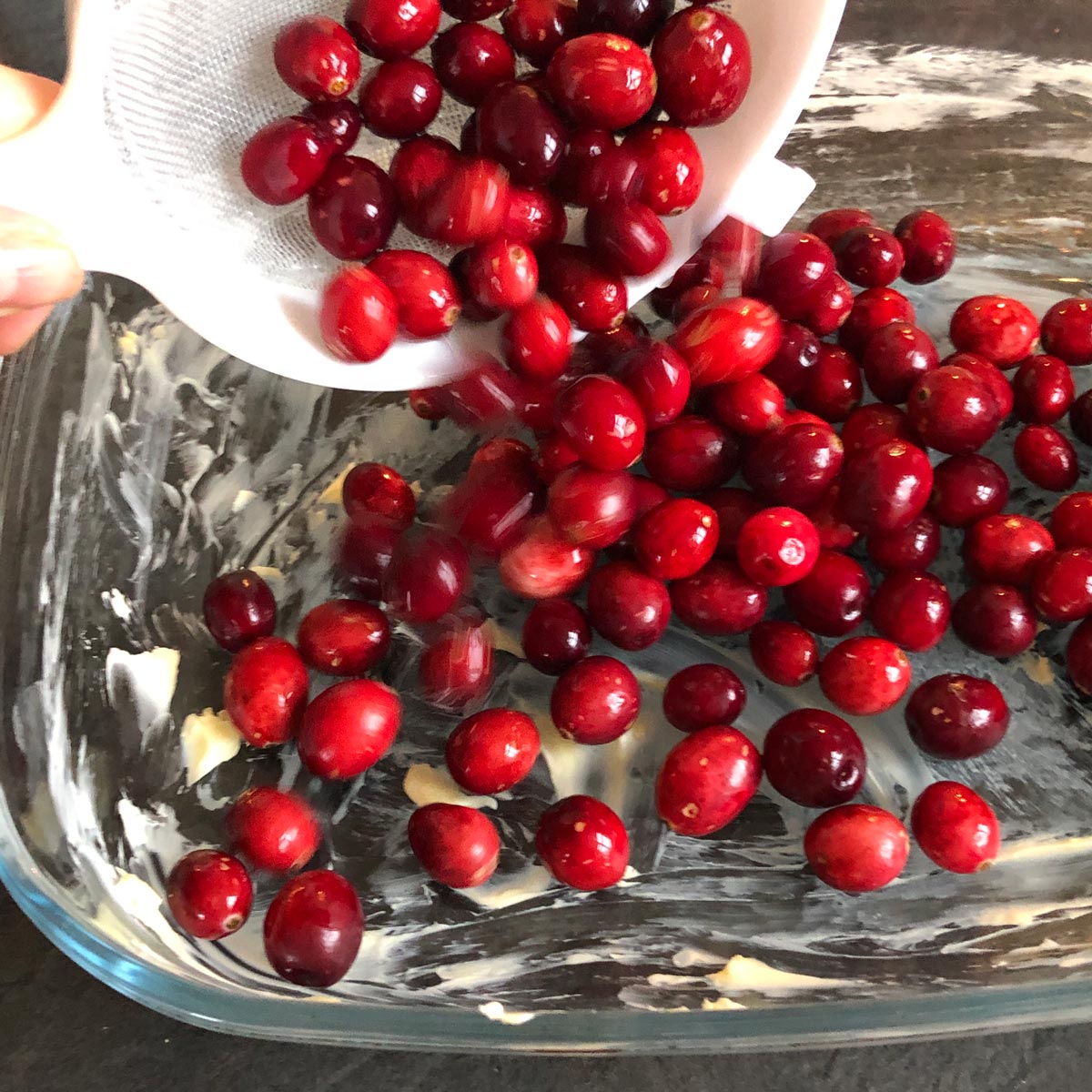 Cranberries in a baking dish.