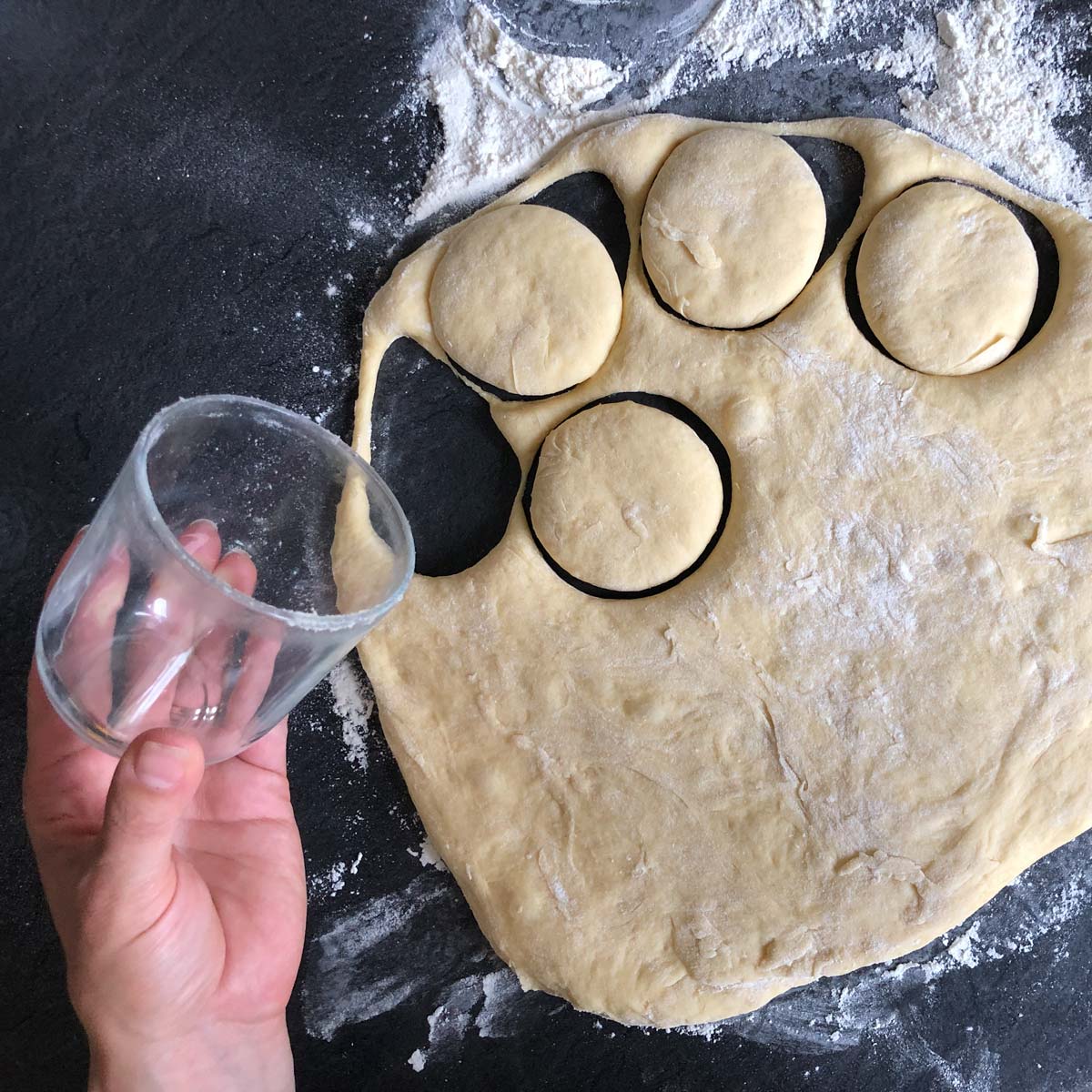 Using a glass as a dough cutter.