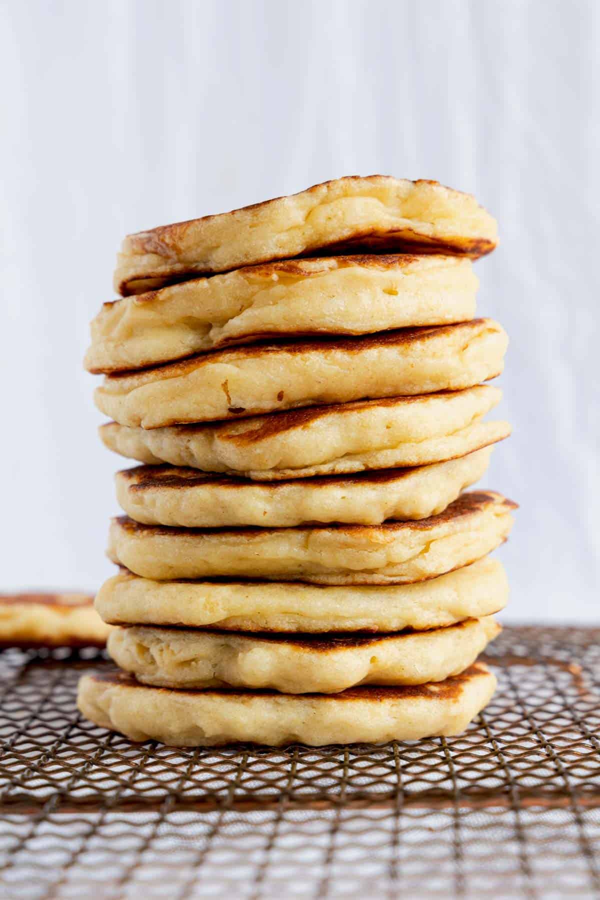 A tall stack of fluffy pancakes.
